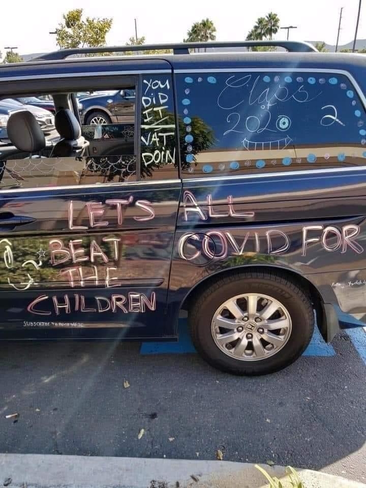 writing on van that looks like it says &quot;let&#x27;s beat the children&quot;