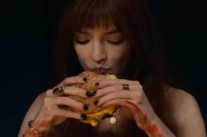 anya taylor joy eating a cheeseburger