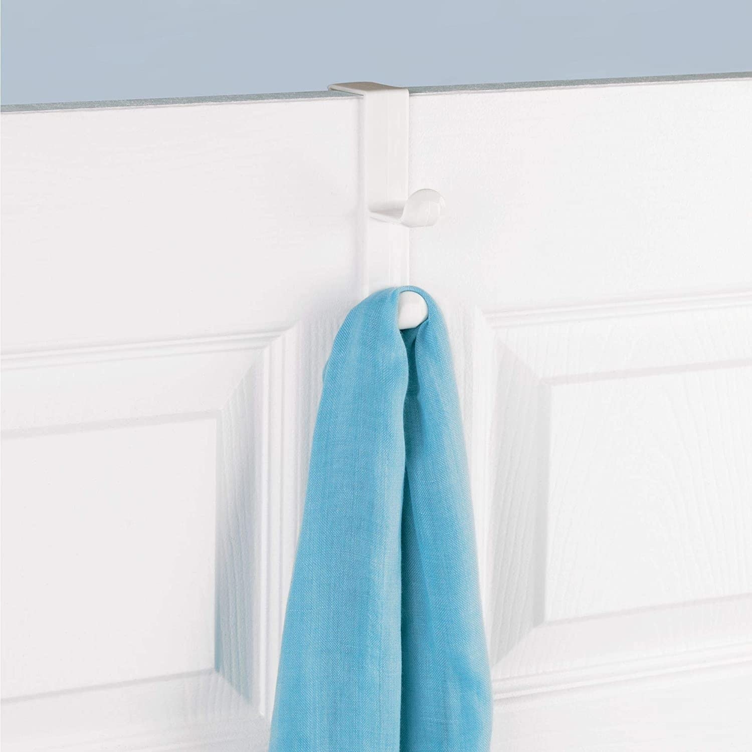 the hook over a door with a towel on it