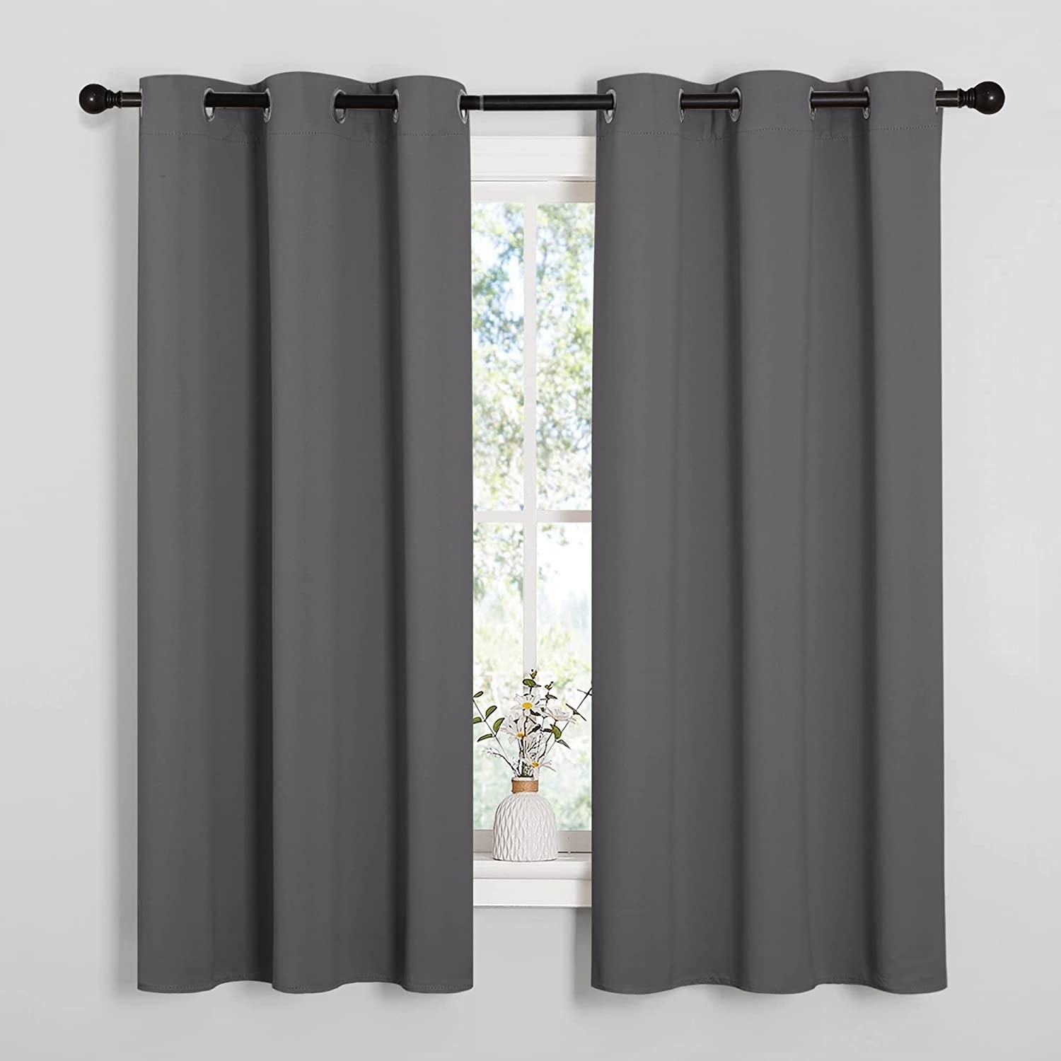 a pair of curtain panels on a window
