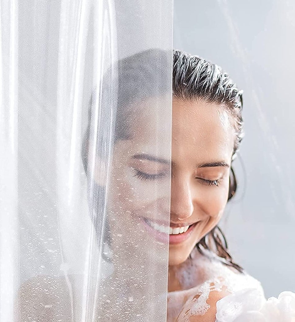 a person behind a clear shower liner