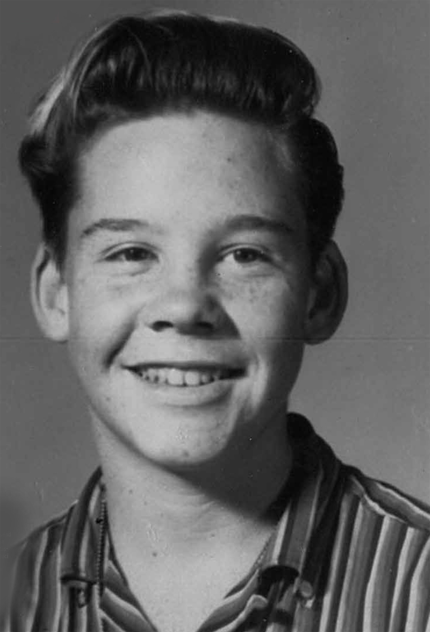 Close-up of a typical smiling kid with freckles from the 1950s