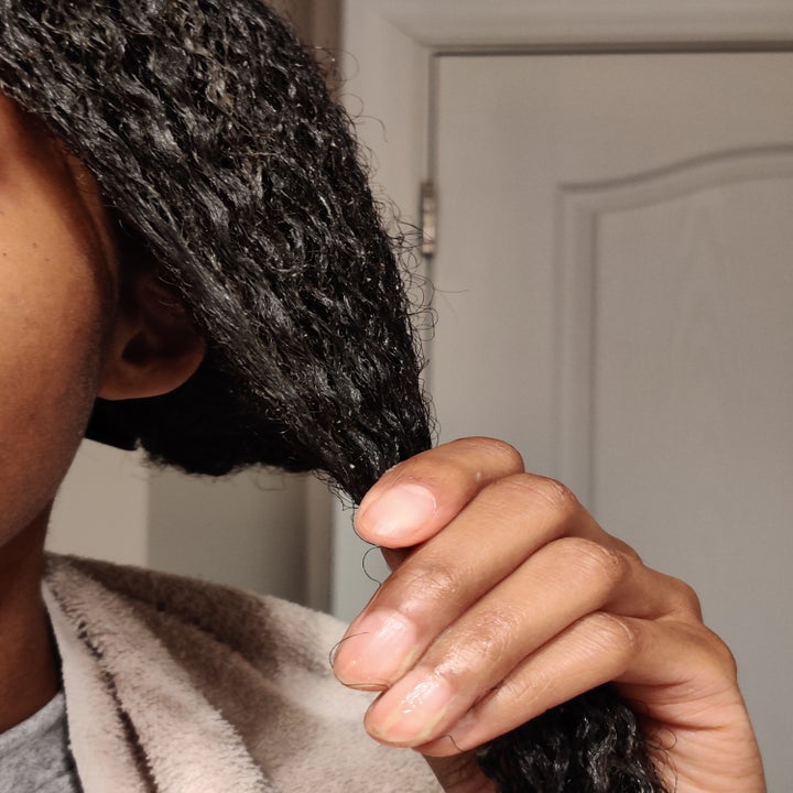 author applying mask to a section of hair