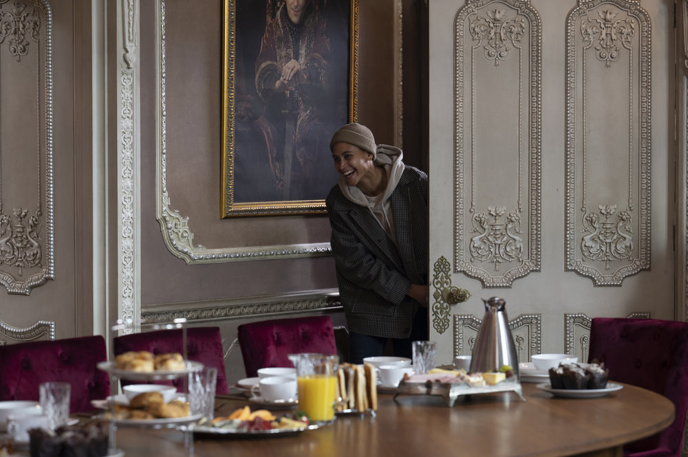 Andie Thurmond sticks their head into the breakfast room