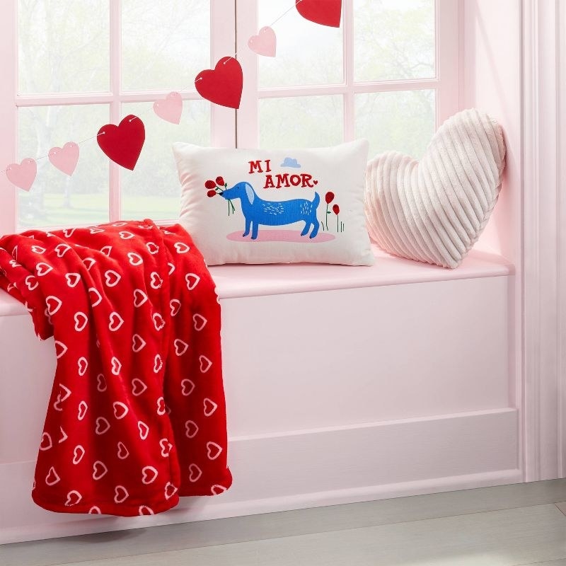the red blanket styled with other valentine's day decor