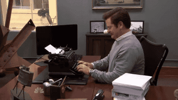 Ron Swanson using a typewriter