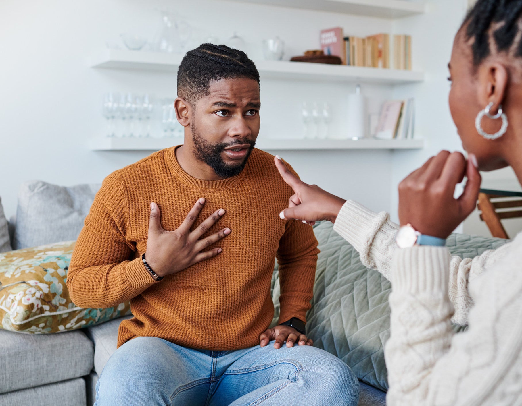 couple arguing, with one partner accusing the other