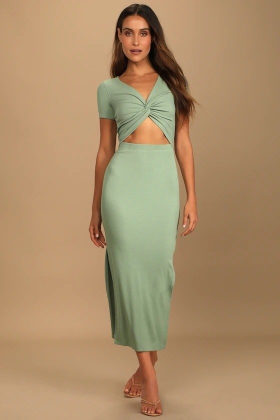The model in the sage green cutout dress