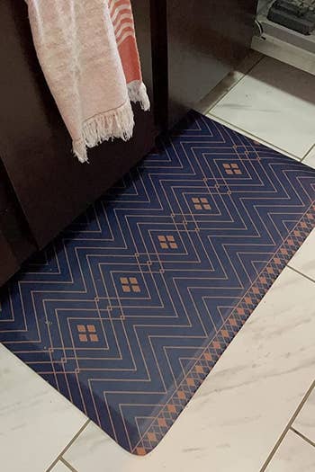 the blue and orange rug sitting on a reviewer's kitchen floor