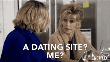 Two women talking about dating websites.
