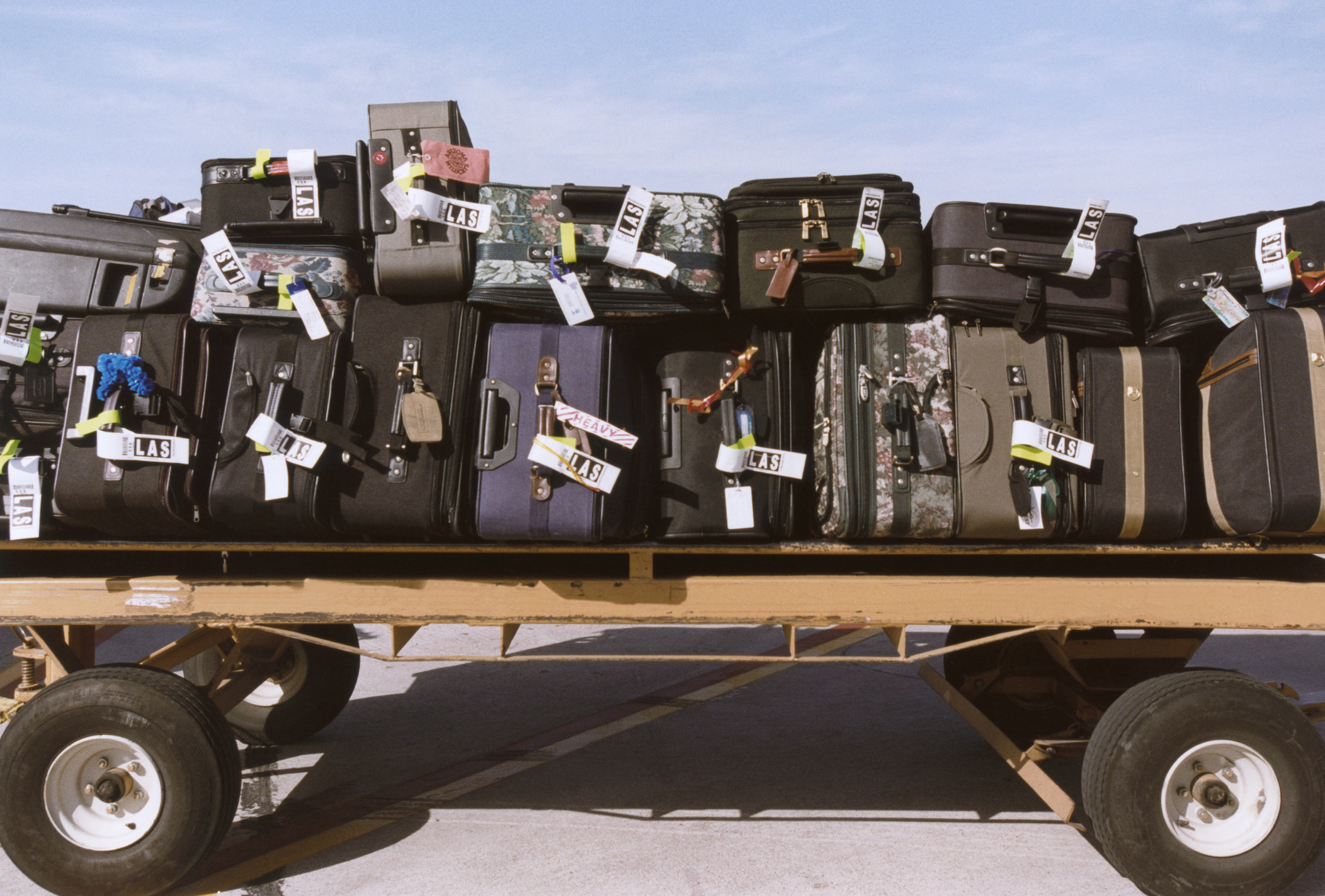 Suitcases on Luggage Cart.