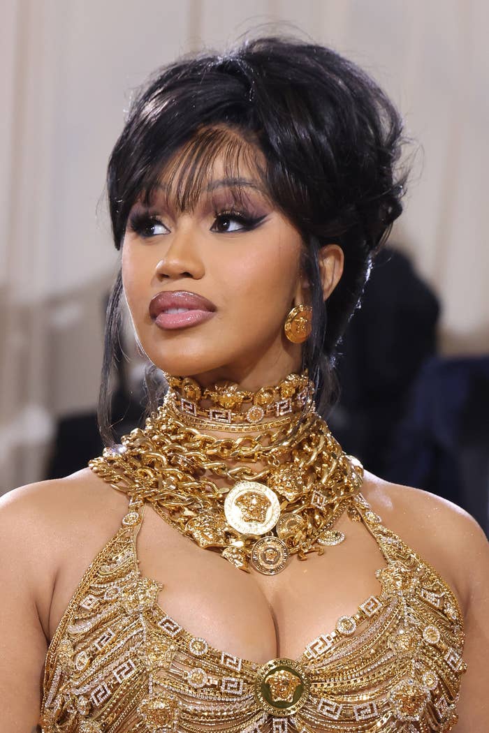 A closeup of Cardi wearing a Versace halter dress at the MET Gala