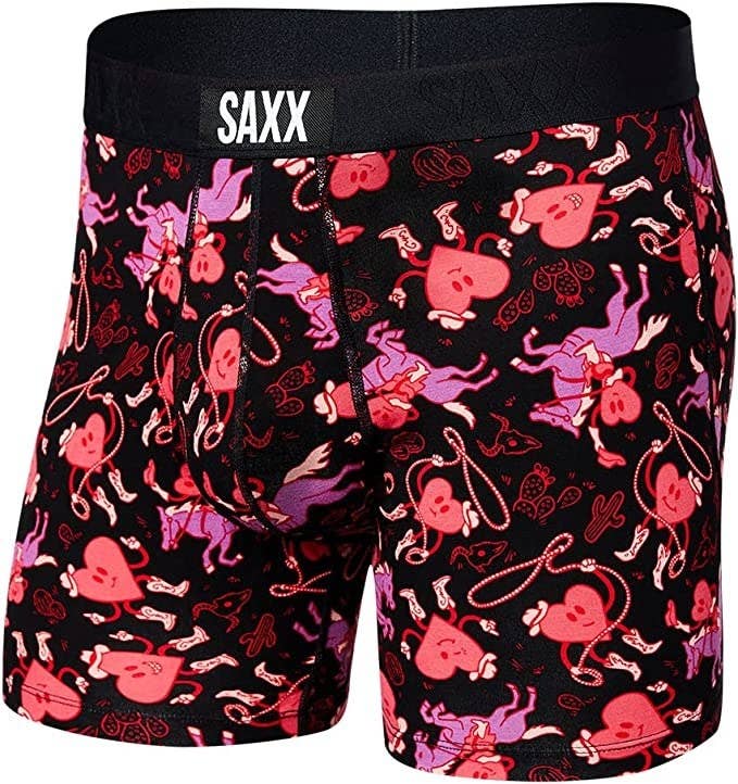 a pair of saxx boxers with hearts printed all over them