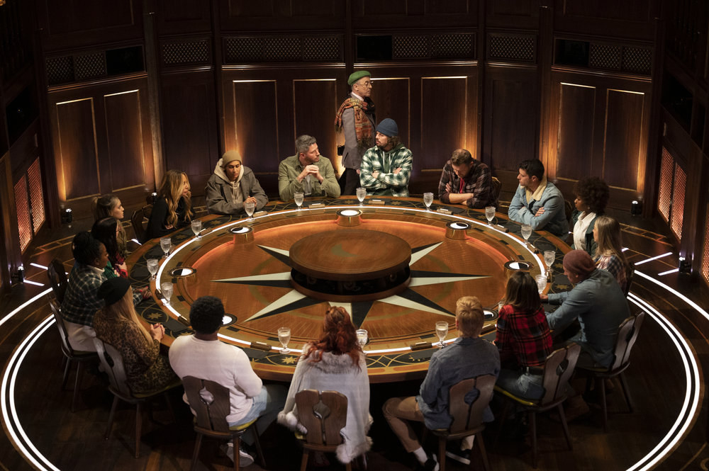 The cast sits around the Round Table