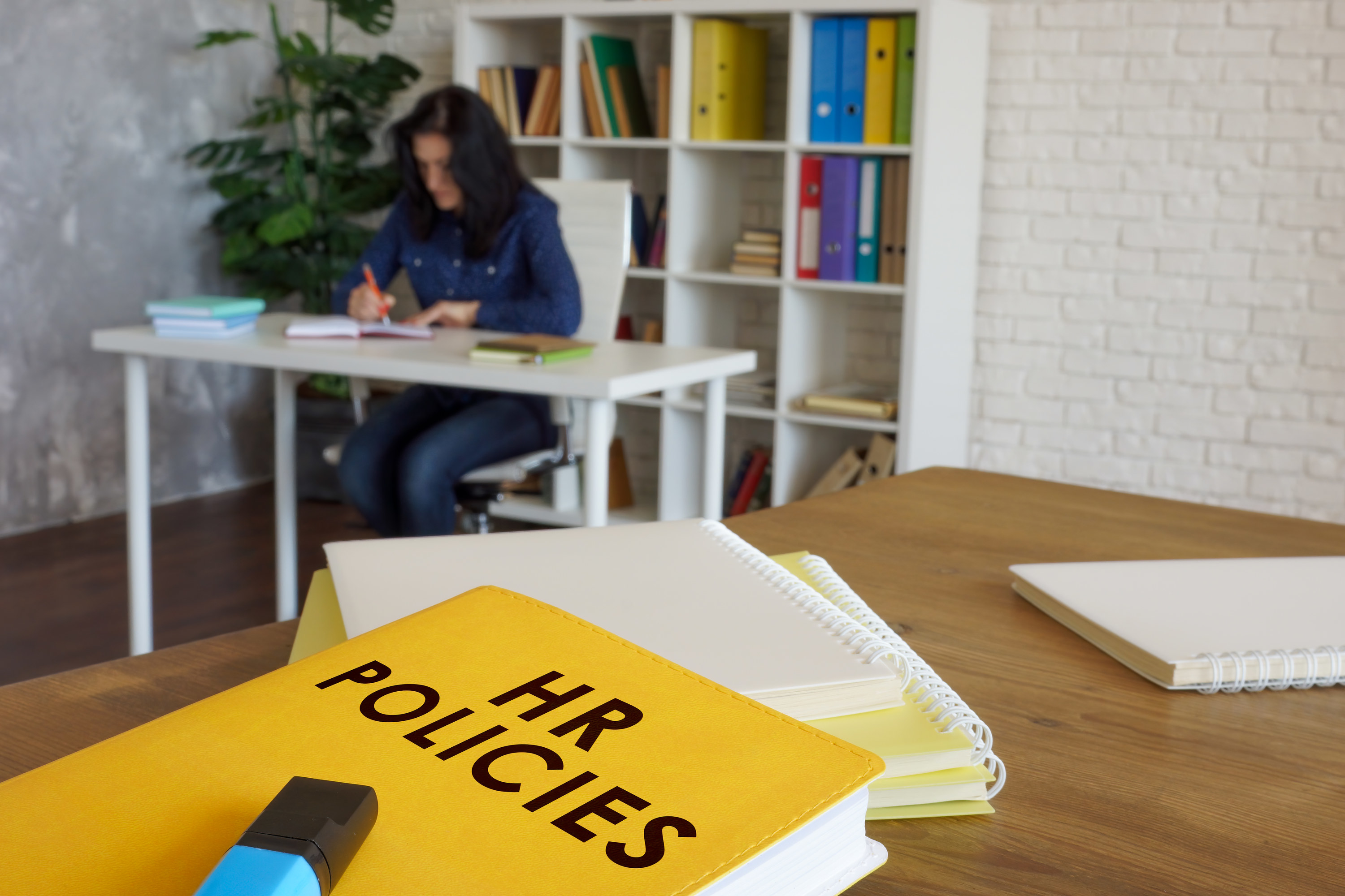 Book titled &quot;HR Policies&quot; on a desk