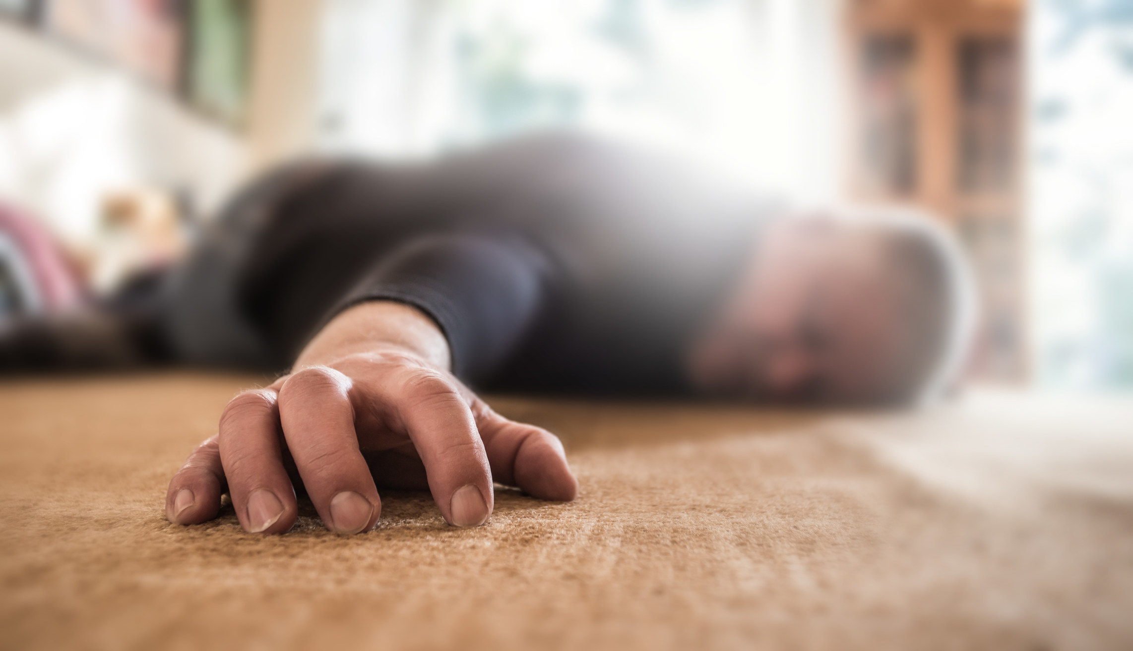 A man laying on the floor