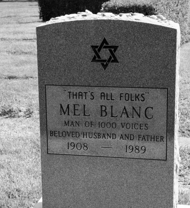 Grave of Blank&#x27;s tombstone which also features a star of david and says man of 1000 voices, beloved husband and father