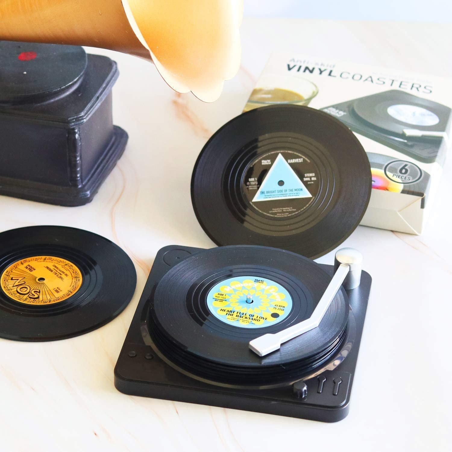 the record shaped coasters on the record player case