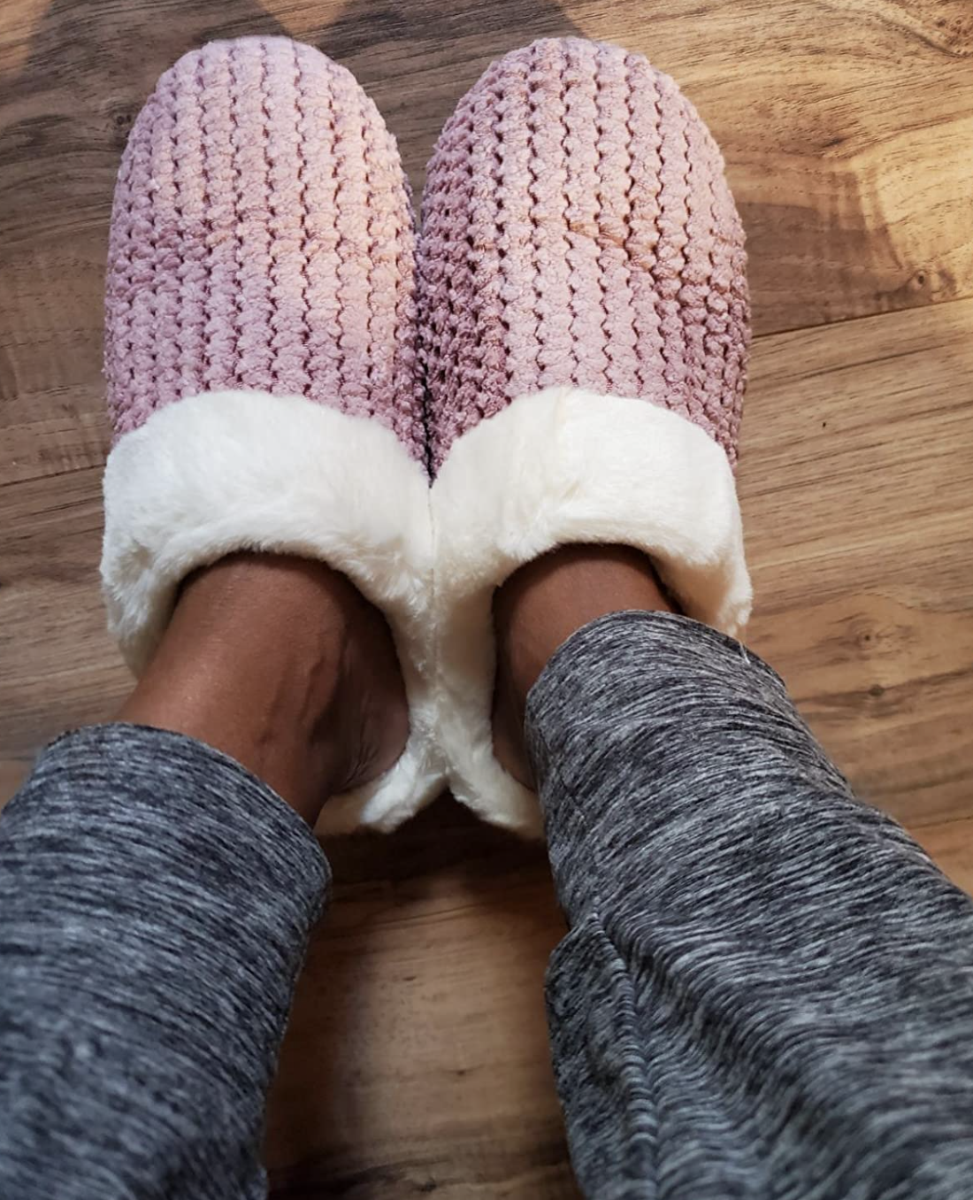 reviewer's picture of the slippers in pink