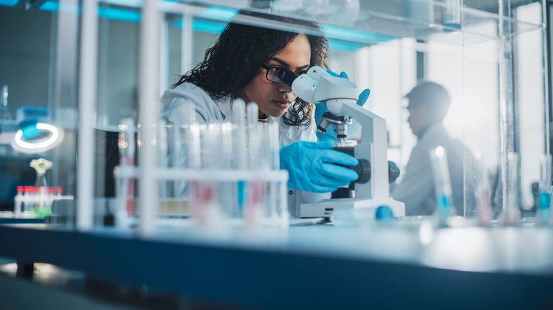 A scientist using a microscope