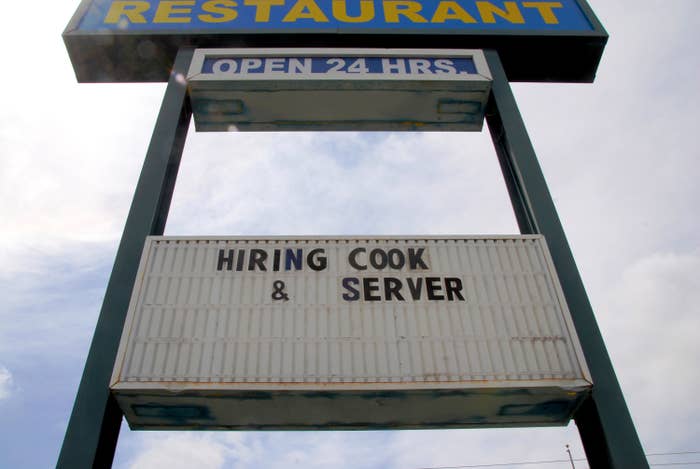 Restaurant with a sign that says hiring cook and server