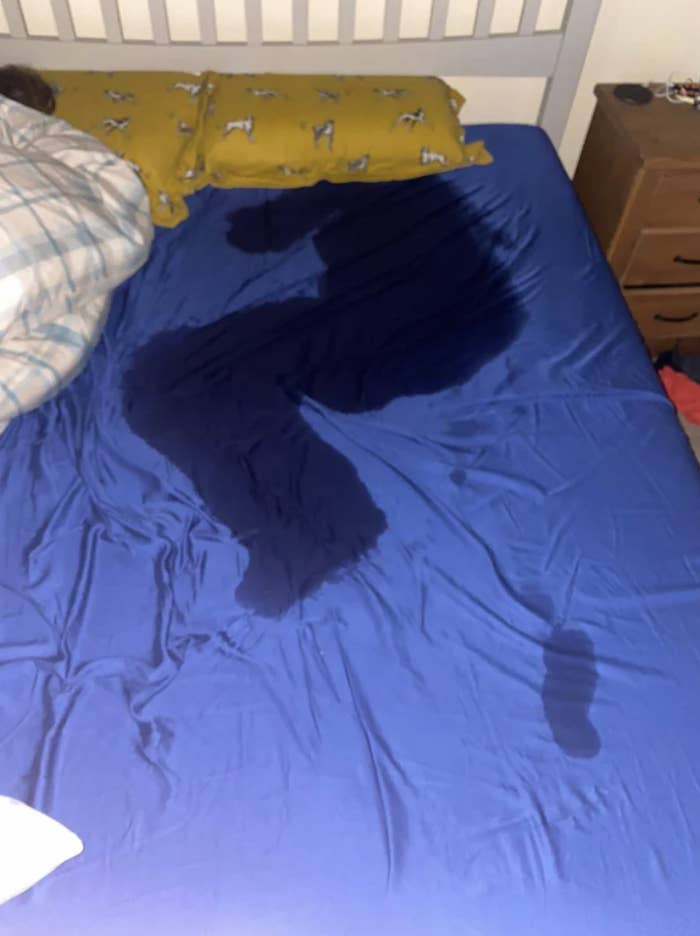sweat stain in the form of a person lying on their side