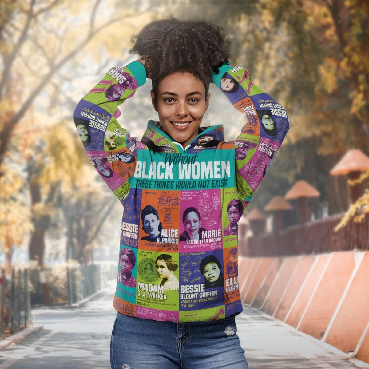A woman wearing a sweatshirt covered in greats like Madam CJ Walker and Alice H Parker