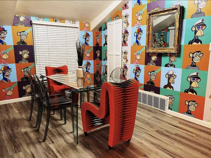 The dining room of the Crypto House, which features Bored Ape Yacht Club wallpaper