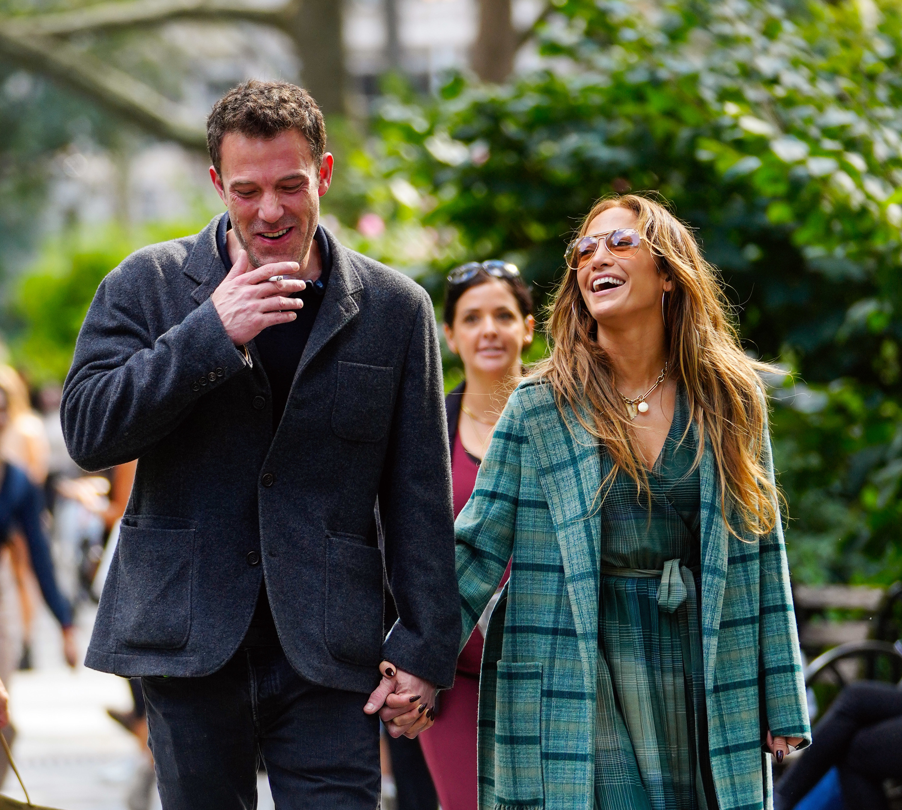 JLo and Ben walking hand n hand in a park