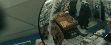 A man in a mask stabs and shoots another man in a convenience store