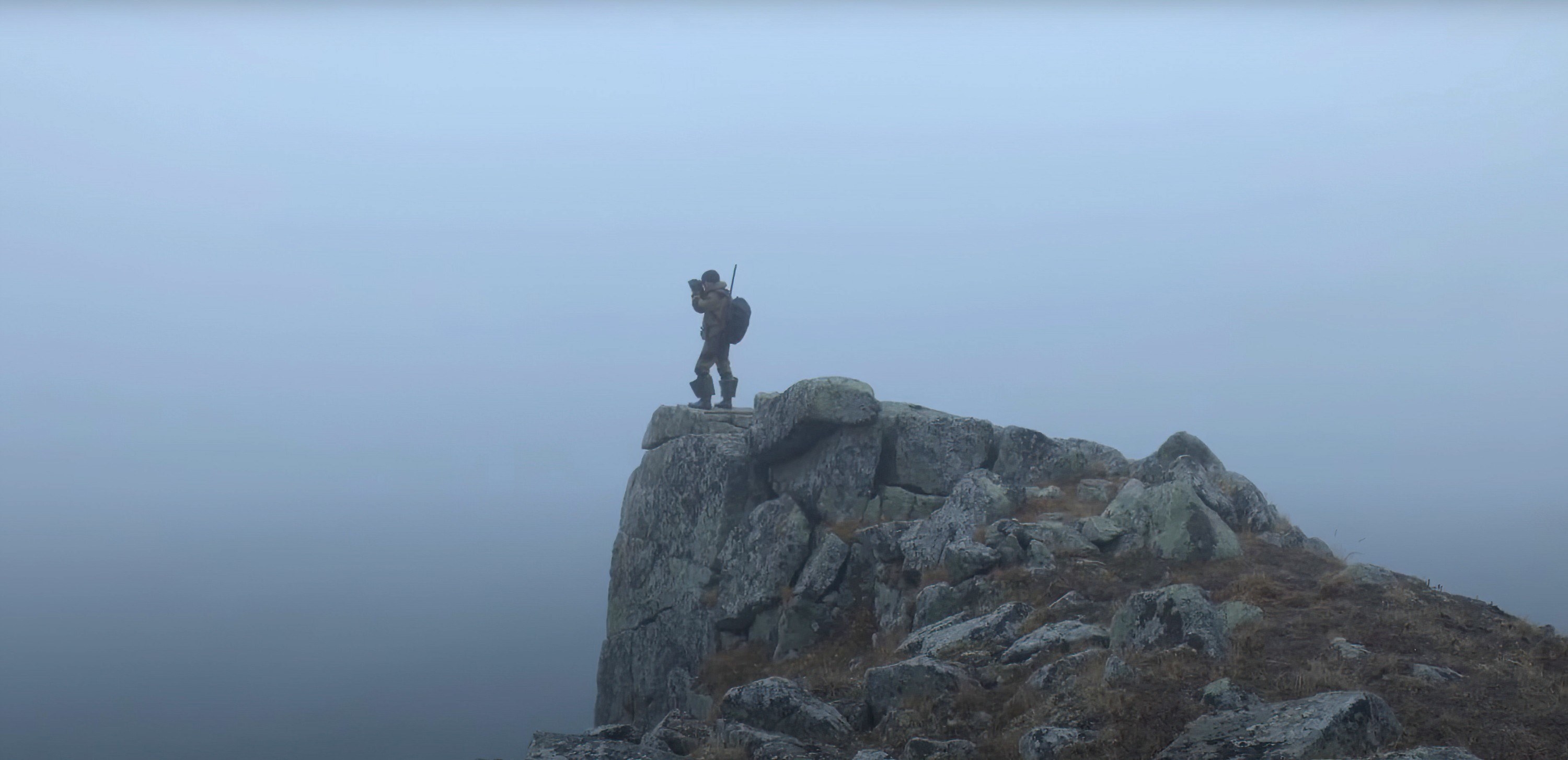 Maxim Chakilev stands on a mountain