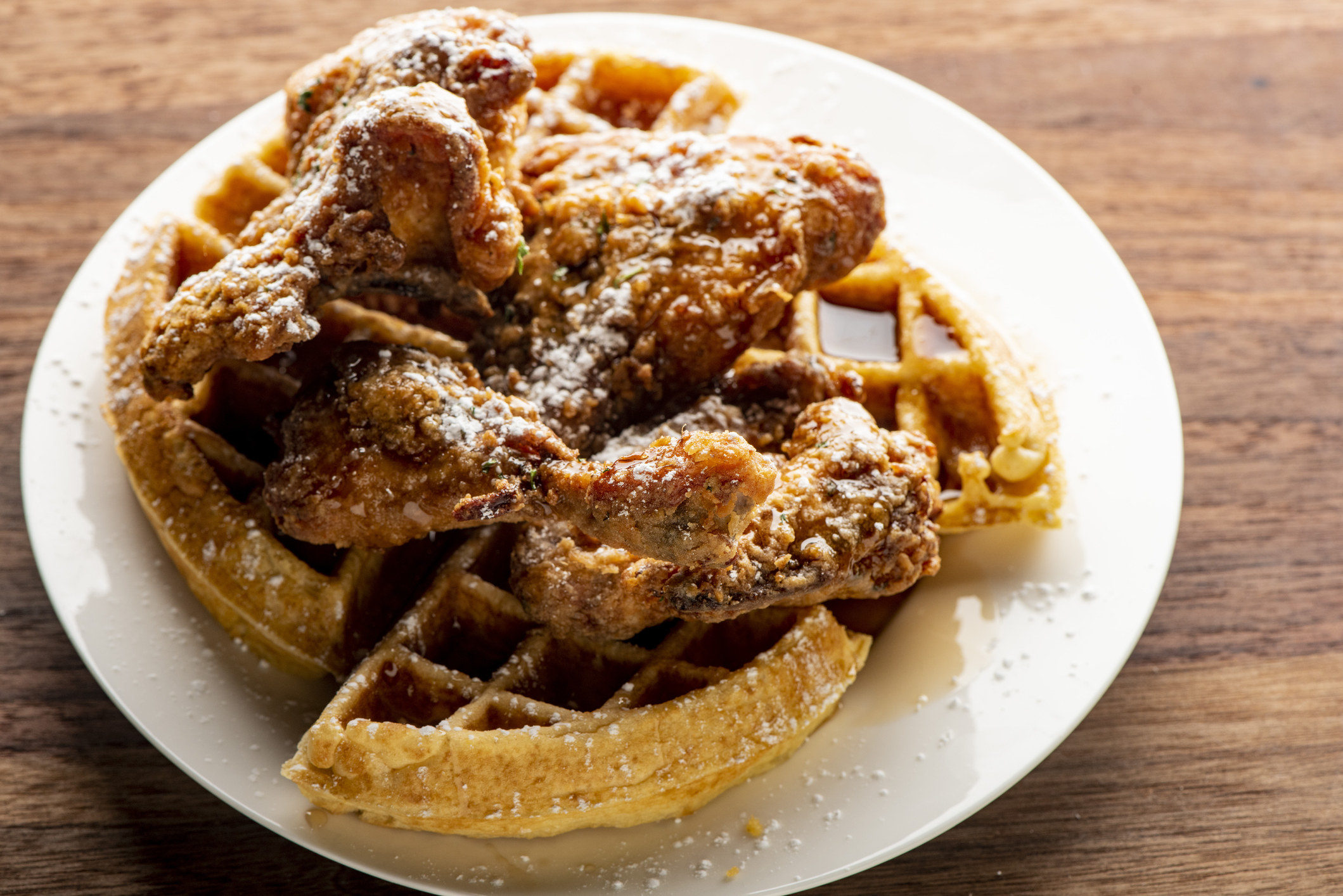 Fried chicken and waffles with syrup.