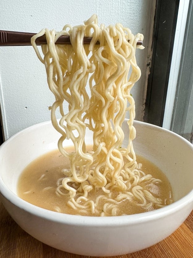 holding up mike&#x27;s ramen out of the bowl