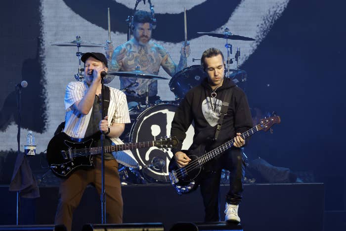 Fall Out Boy members Patrick Stump, Andy Hurley and Peye Wentz perform together.