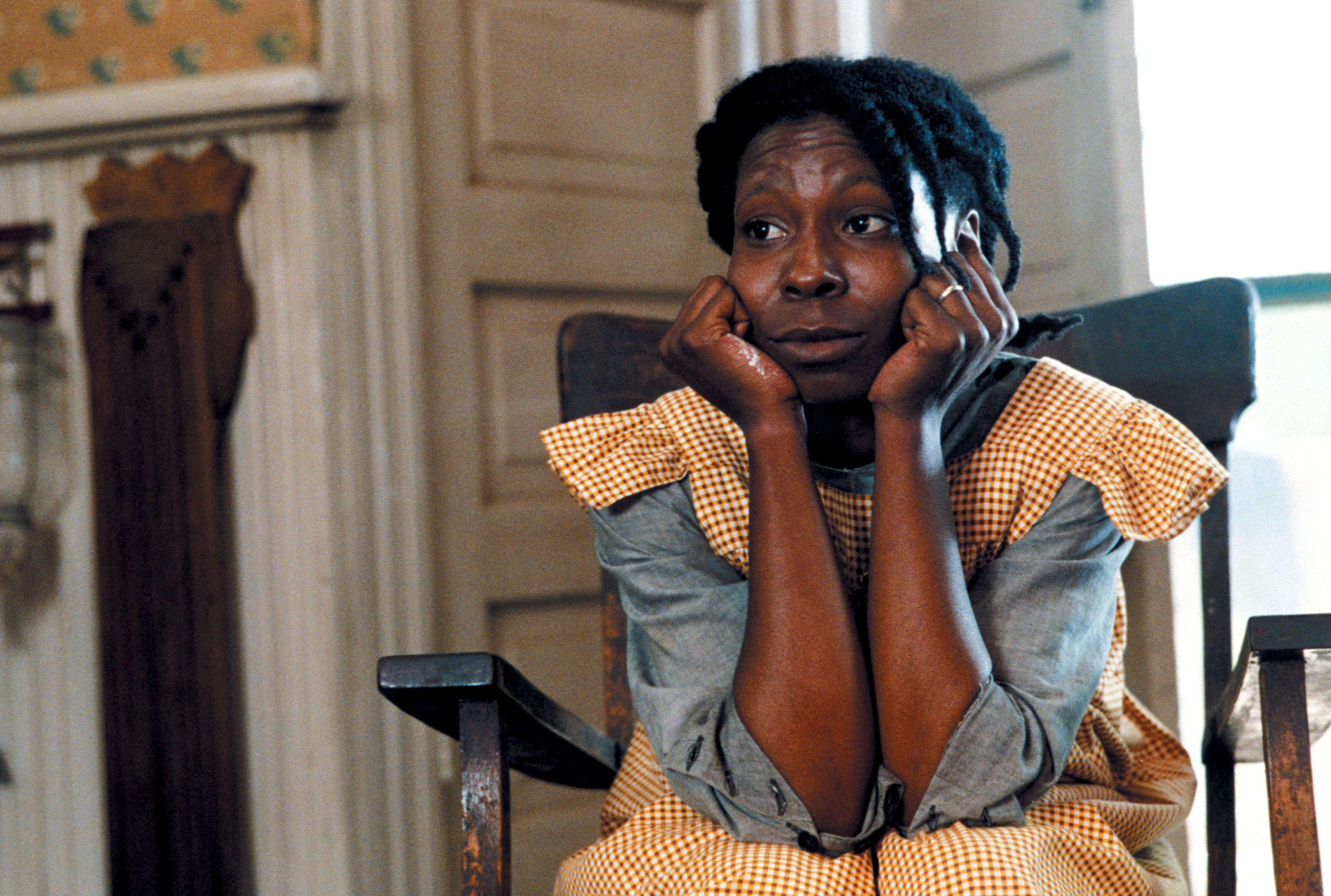 closeup of whoopi goldberg sitting in a rocking chair