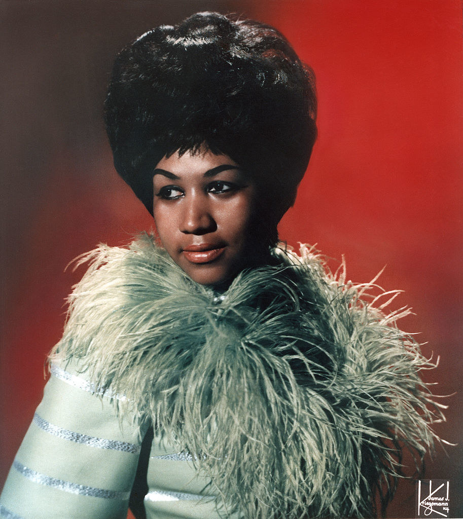 Aretha in a fluffy-collared outfit
