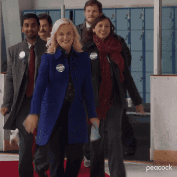 GIF of the Parks and Rec characters walking and waving