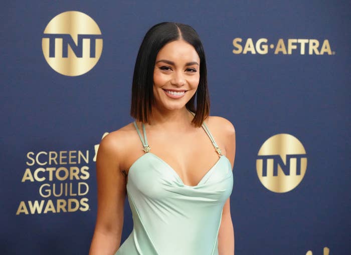 A close-up of Vanessa smiling on the red carpet of the Screen Actors Guild Awards; she is wearing a satin spaghetti-strap dress