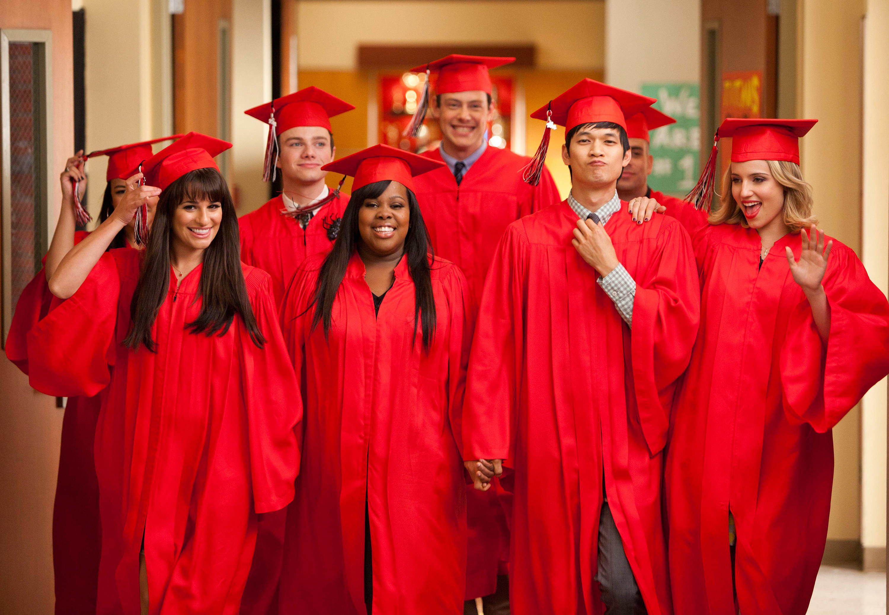 teens in their graduation caps and gowns