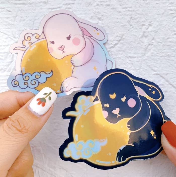Model holding stickers of Cute Bunnies on the Moon