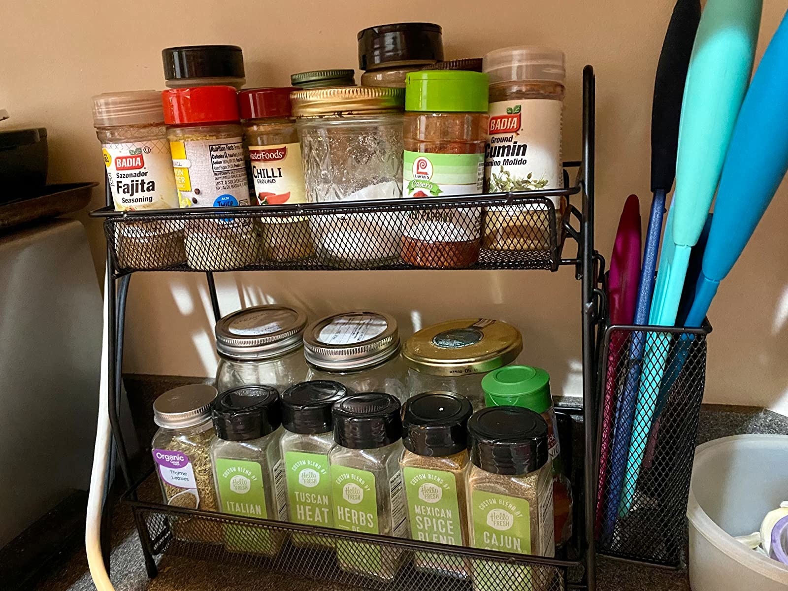 Reviewer image of shelf with spices on their countertop