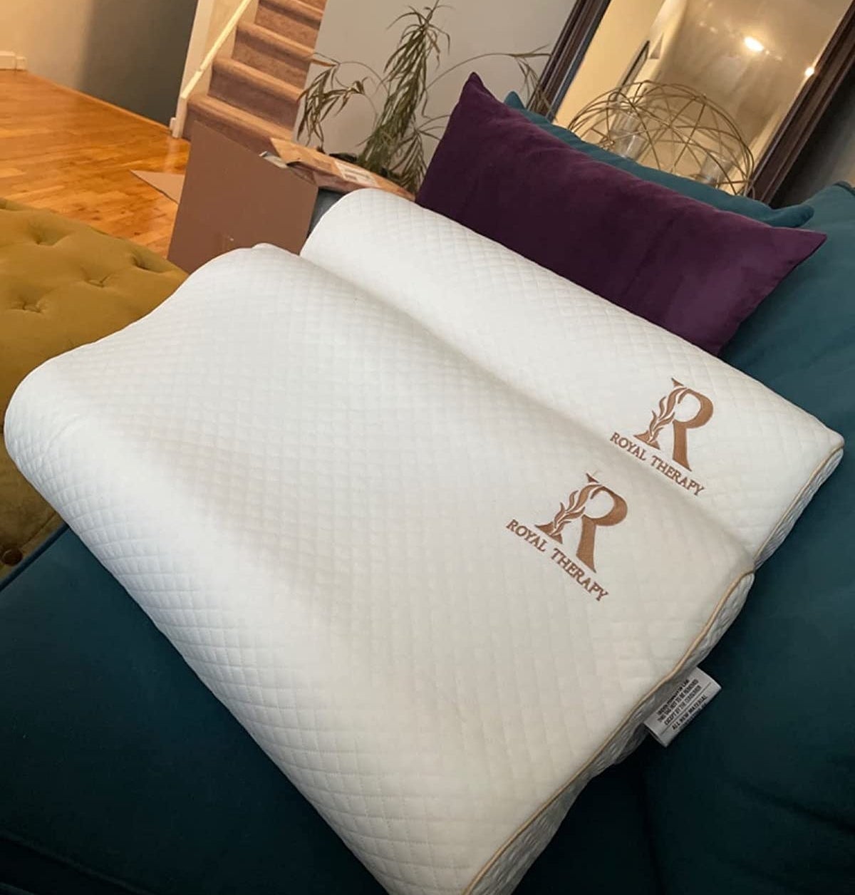 Reviewer image of two memory foam pillows on their couch