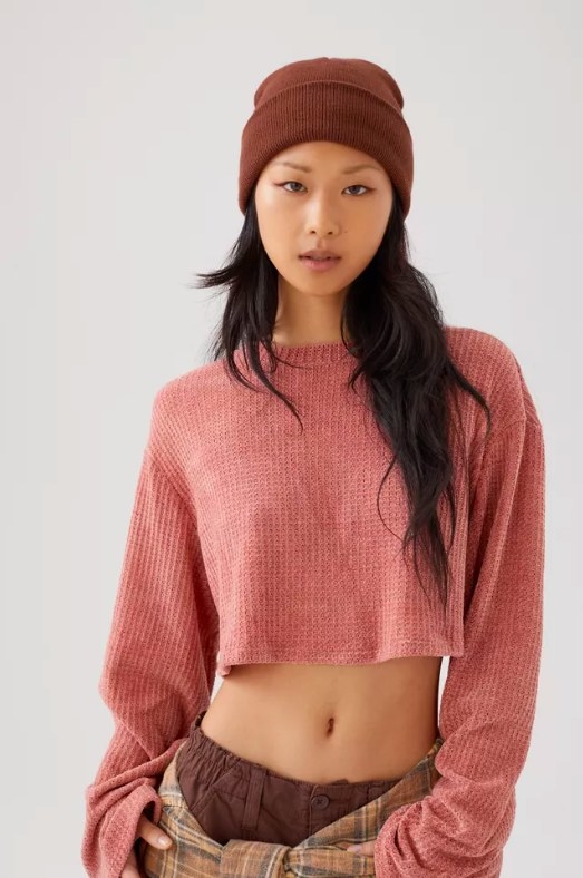 Model wearing pink sweater