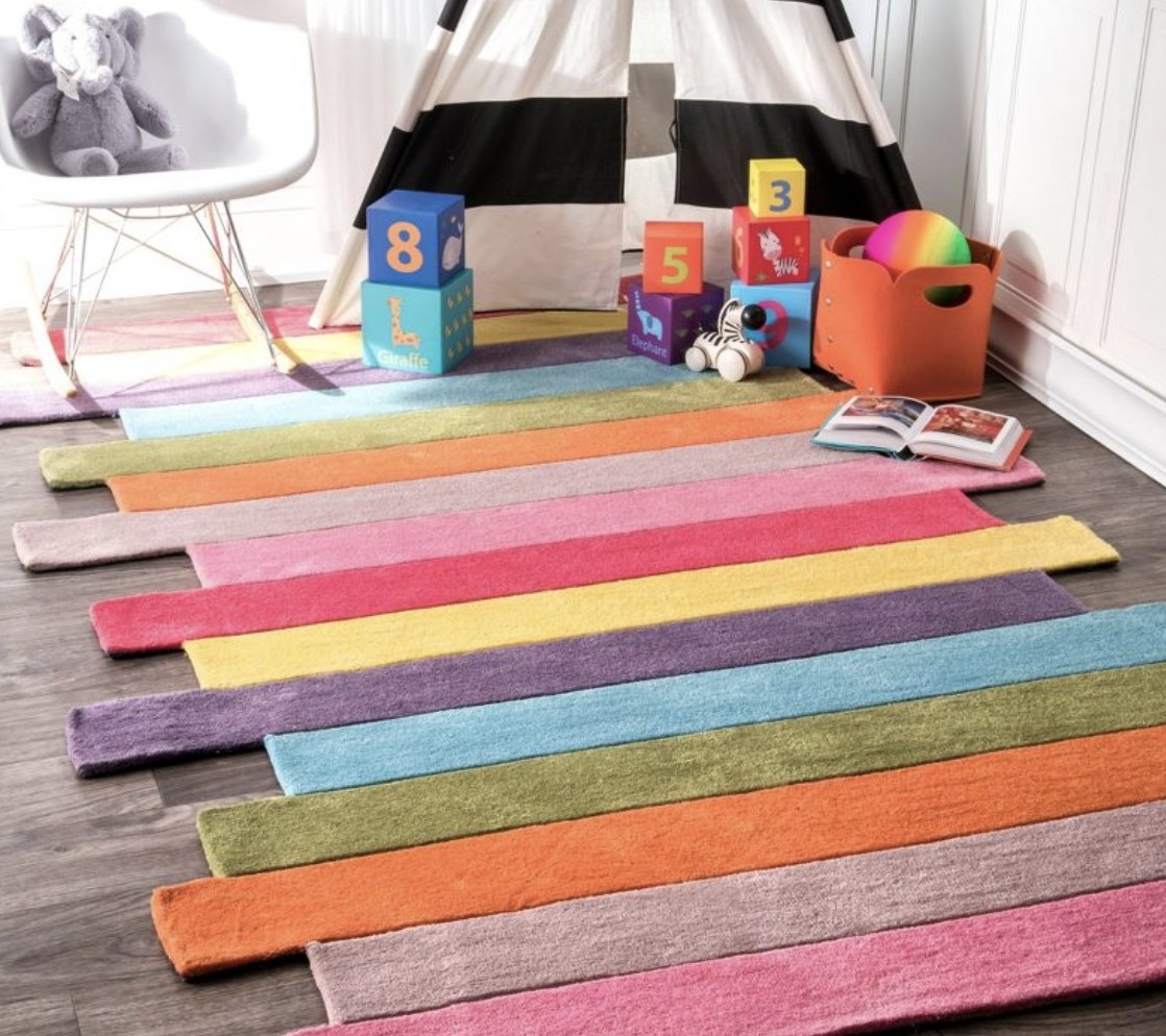 A colorful accent rug in a child&#x27;s play area