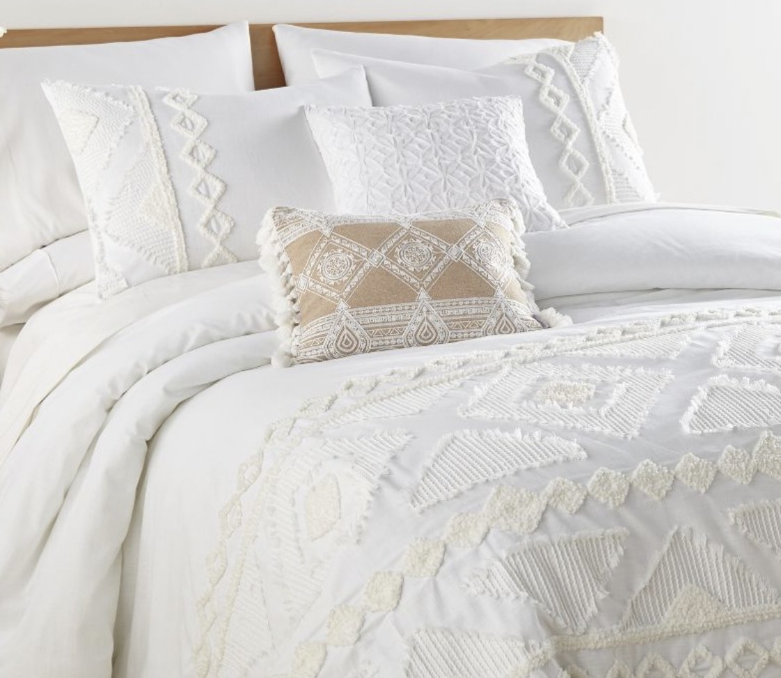 A white duvet cover with tufting