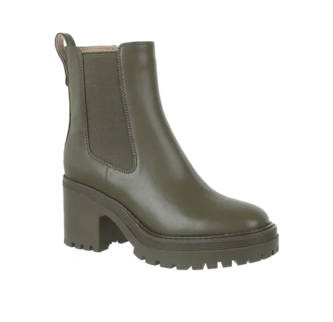 An olive green heeled chelsea boot