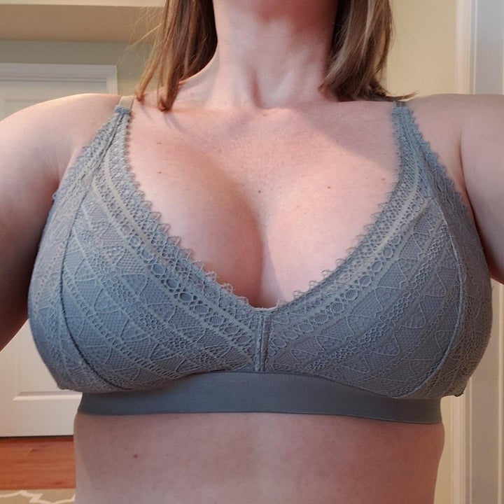 a reviewer wearing the bra in gray