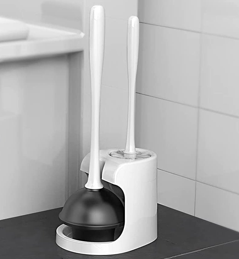 the plunger and brush bowl set beside a toilet