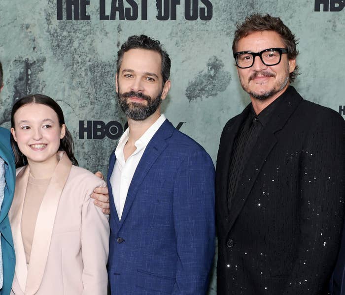 Neil poses for a photo with Pedro Pascal and Bella Ramsay at a red carpet event for The Last of Us