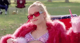 Elle Woods wearing a lot of pink and waving